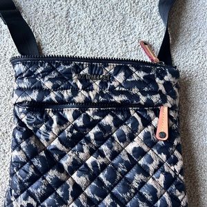 Zip top closure ext front zip pocket, back snap pocket 6 interior pockets